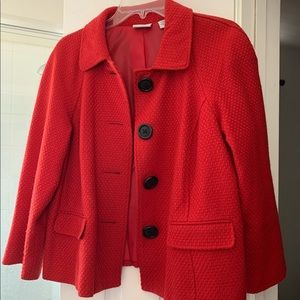 Waist length woven red jacket, black buttons.